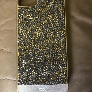 Gold, silver, and black phone case